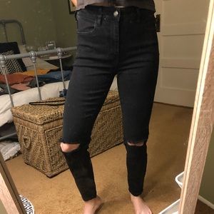 High waisted skinny black jeans, with knee slits